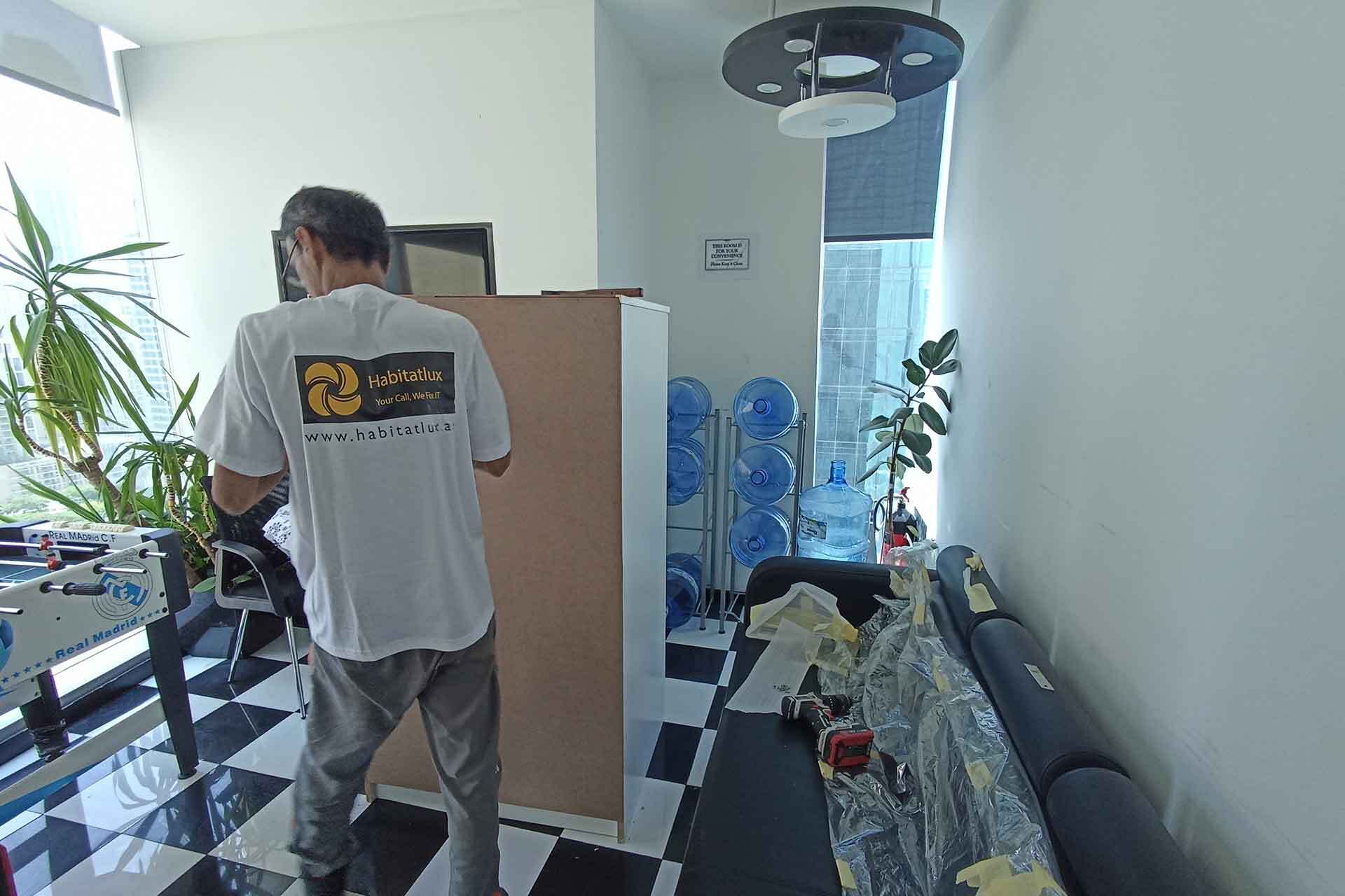 habitatlux technician working in a home for maintenance