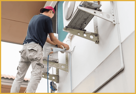 a tehnician installing an ac compressor