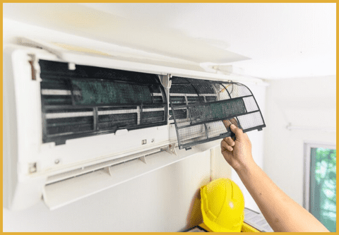 a technician maintaining the head of the AC