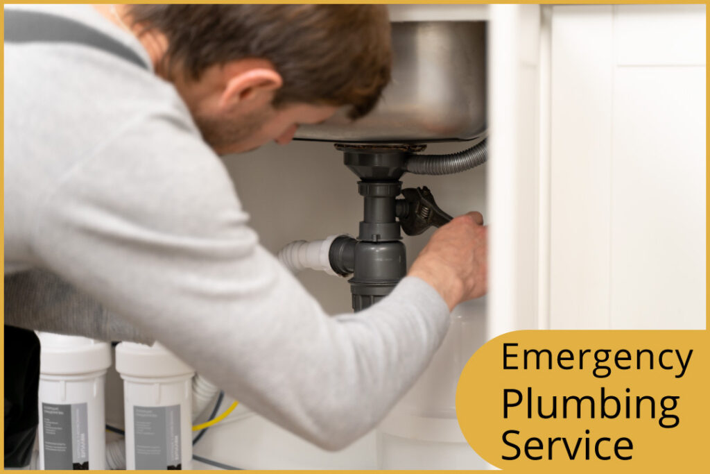 a plumber repairing a pipe of the washroom handwasher