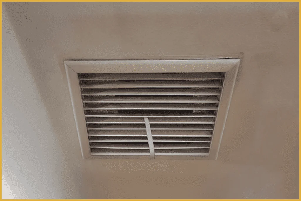 A vent installed in a room featuring a clean white ceiling, providing ventilation and air circulation.