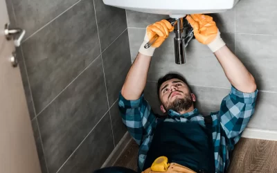 habitatlux property maintenance plumber repairing a basin